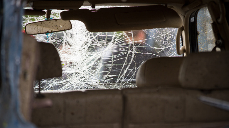 A car with a broken windshield.