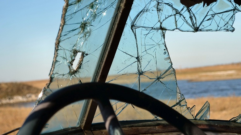 A car with a broken windshield.