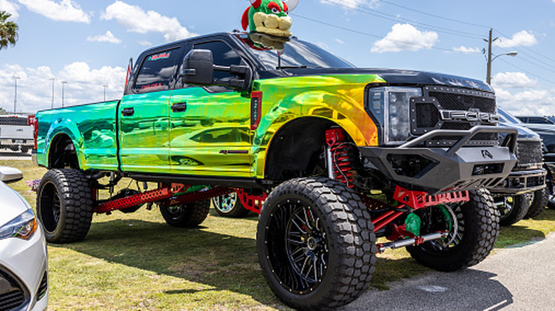 A Ford truck lifted so much it doesn't even fit in the frame.