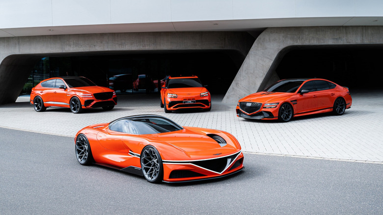 Four of Genesis' Magma concept vehicles parked in front of an upscale garage