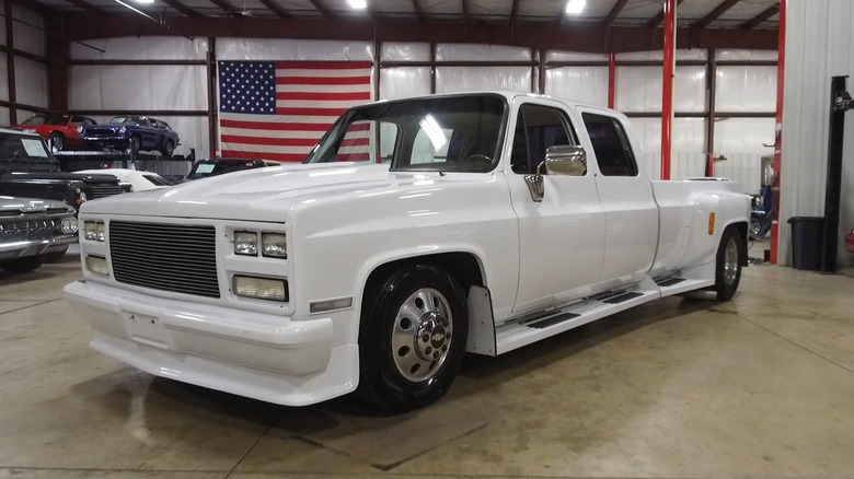 A 1989 Chevrolet R3500 Crew Cab pickup truck in a building