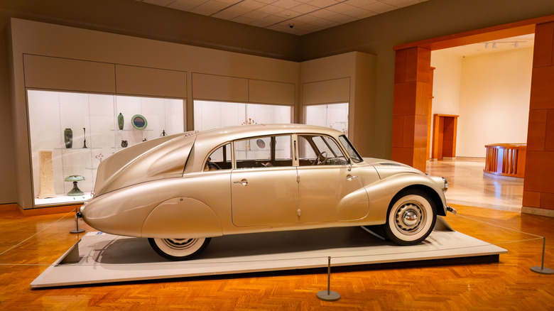 A silver Tatra T87 in a museum