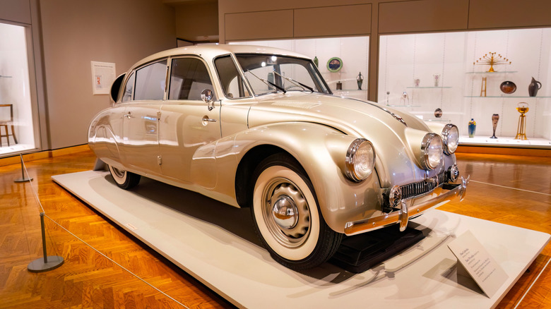 A silver Tatra T87 in a museum