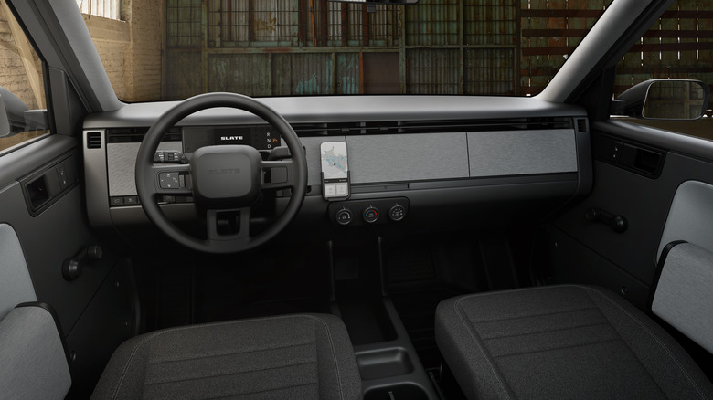 The bare-boned interior of the Slate truck in grey plastics and fabrics.