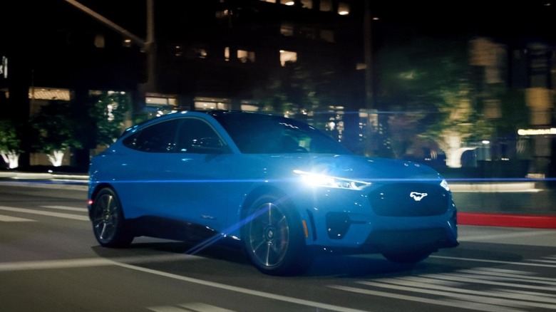 A front-quarter driving shot of a 2023 Mustang Mach-E GT