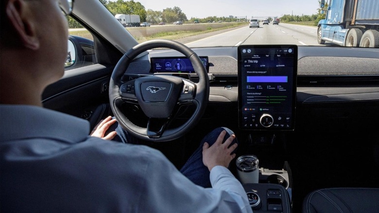 A driver using Ford BlueCruise for handsfree driving