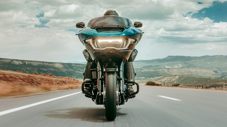 Harley Davidson Road Glide motorcycle 2026 on an open road.