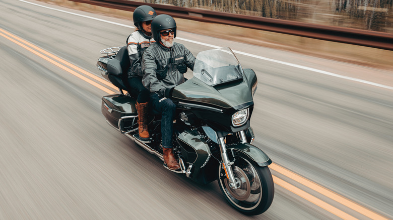 A rider and passenger touring an open road on a 2026 Harley-Davidson Street Glide Limited