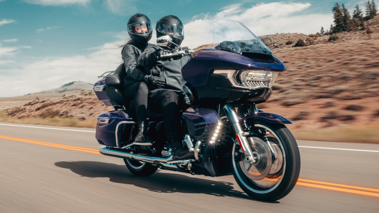 Two riders tour a desert landscape on a 2026 Harley-Davidson Road Glide Limited