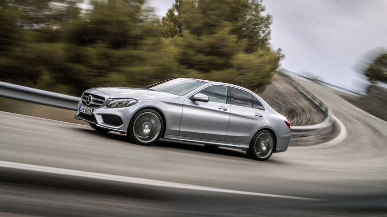 A silver Mercedes-Benz C300 on a roadway.