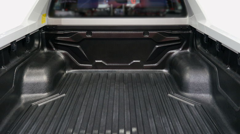 An empty truck bed of a modern pickup truck