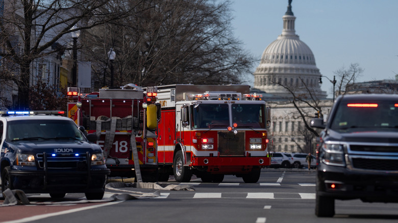 Emergency vehicles turning on a street road