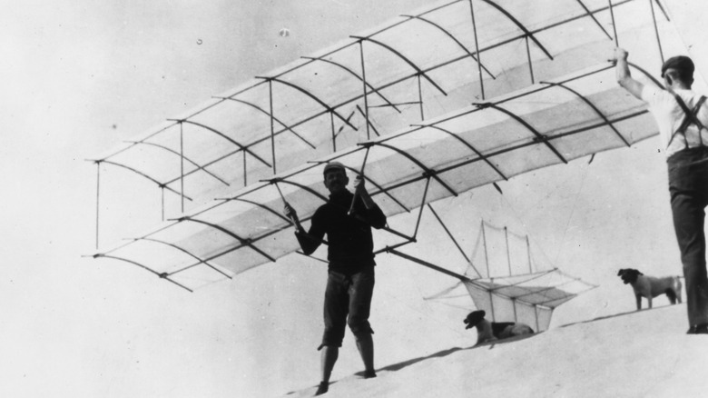Augustus Herring getting ready to pilot an early glider near Lake Michigan