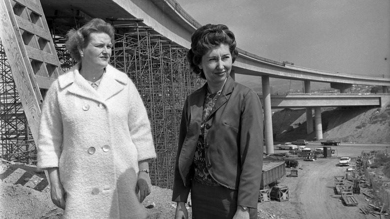 Marilyn Reece, left, stands with Carol Schumaker by the three level Santa Monica–San Diego Freeway interchange she designed.