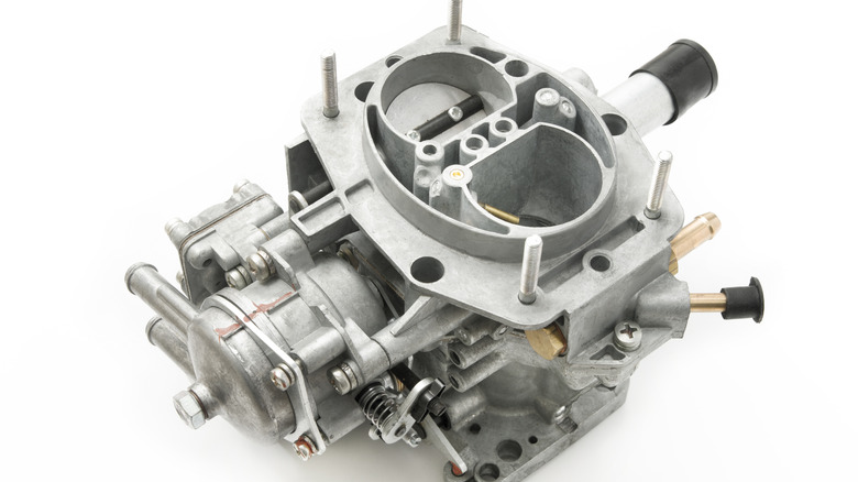 A carburetor against a white background