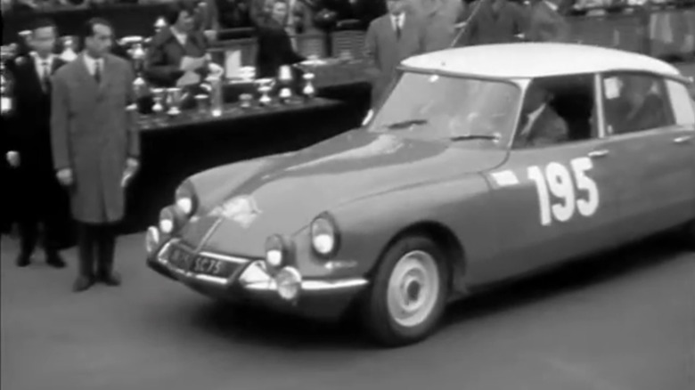 A black and white shot of the 195 Citroën DS at the 1966 Monte Carlo Rally award ceremony.