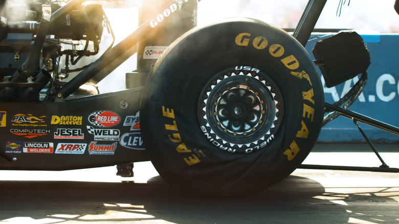 A Goodyear drag racing tire wrinkles and deforms under acceleration