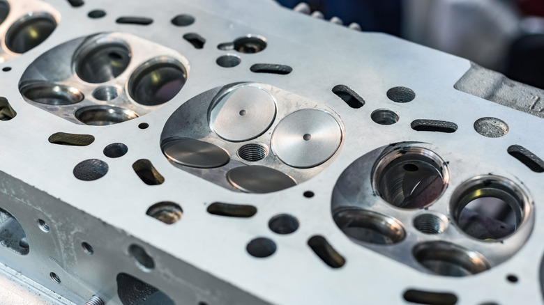 An engine head showing four valves per cylinder