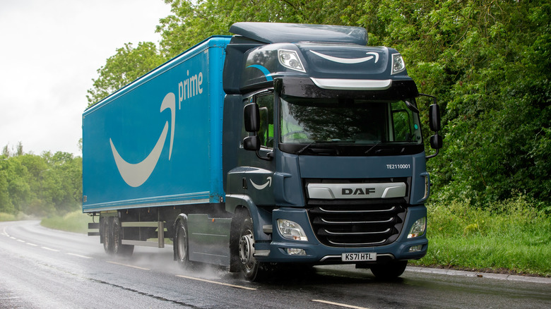 An Amazon motortruck driving down a road