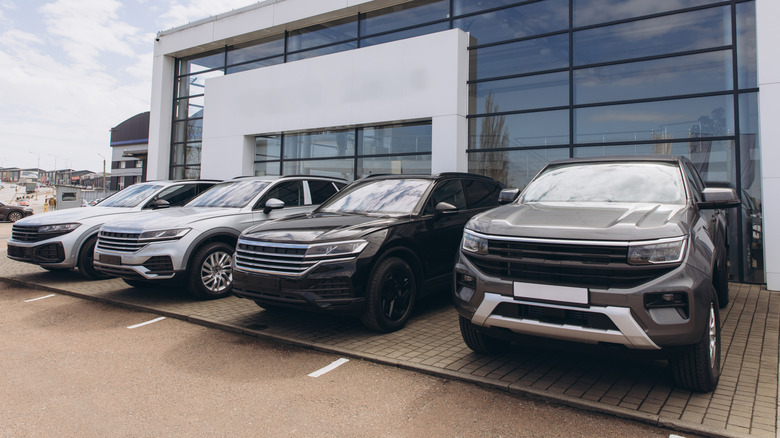 Cars for sale outside modern dealership