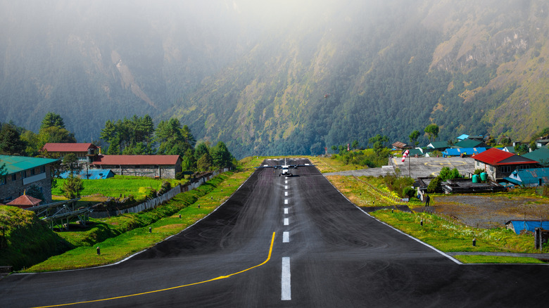 An aircraft on the runway at Tenzing Hillary Airport in Lukla, Nepal