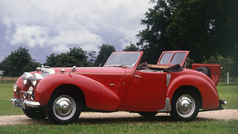 Side shot of a red 1948 Triumph Roadster