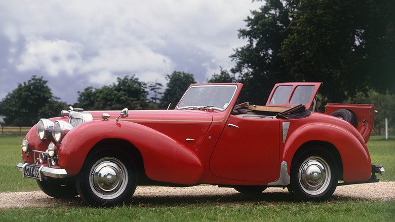 Side shot of a red 1948 Triumph Roadster