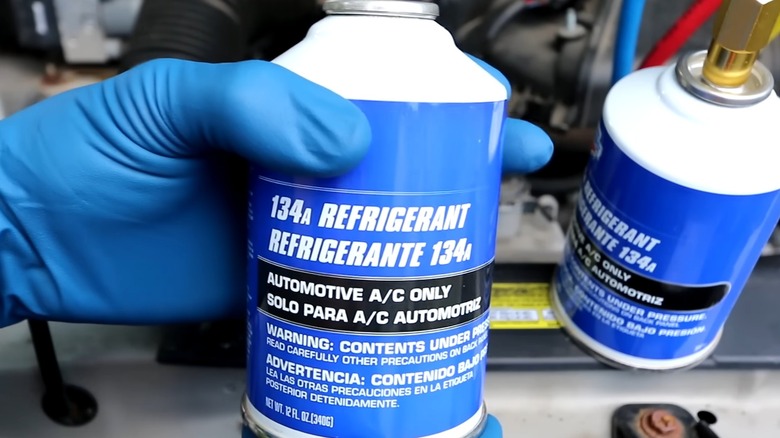 A can of R134a refrigerant for car AC