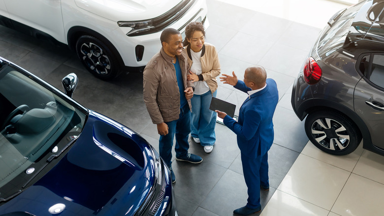 People at car dealership