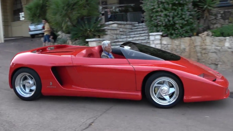 The red Ferrari Mythos concept, based on the Testarossa, driving to a car show in Monaco
