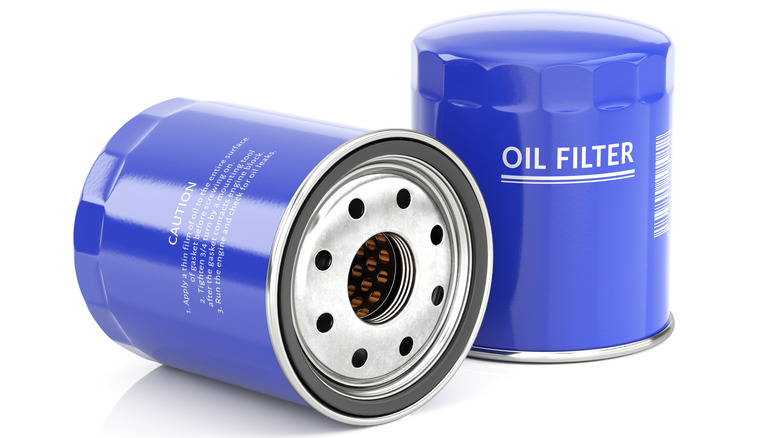 A pair of blue spin-on engine oil filters against a white background.