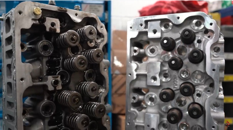 A cast-iron cylinder head for 6.6-liter Duramax diesel engine (left) compared to aluminum head