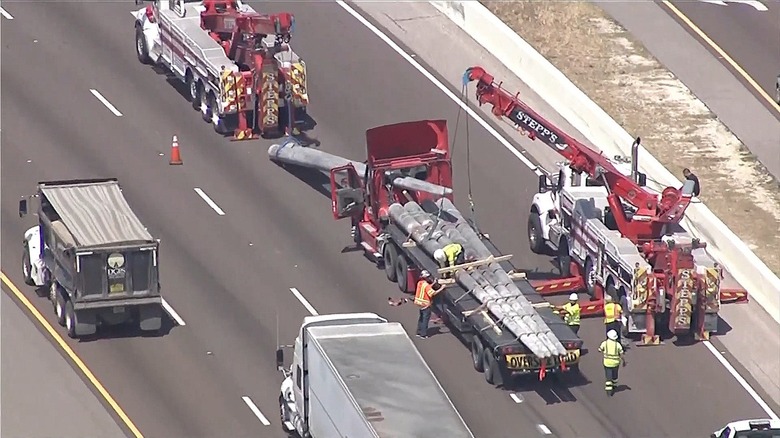 The aftermath of a Tampa-area accident where semi truck's cargo was thrown through the cab