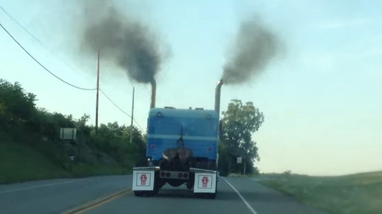 A semi with a Series 71 two-stroke releasing black smoke