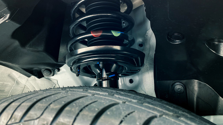 Suspension strut inside wheel well