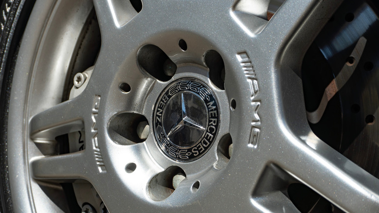 A close-up of silver Mercedes-Benz car wheel