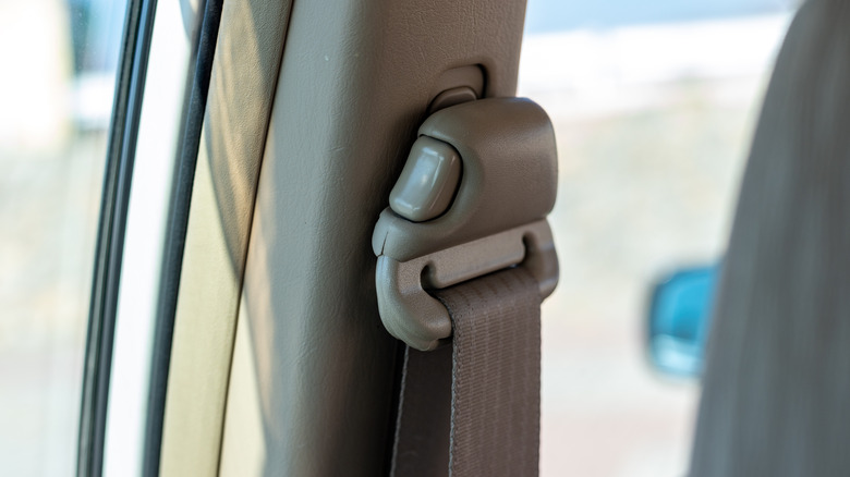 A seat belt with adjustable height positioning