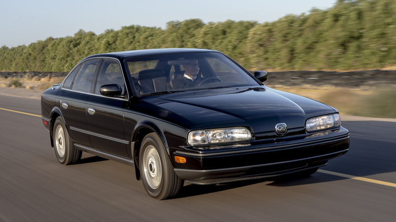 A first generation Infiniti Q45 being driven on the highway.