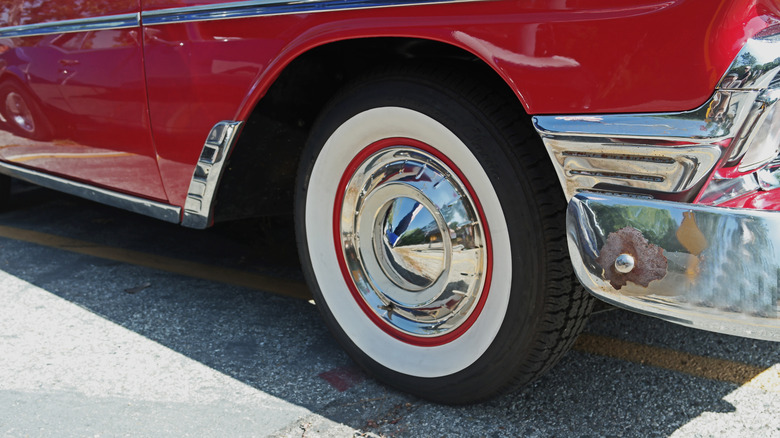 A vintage car with whitewall tires
