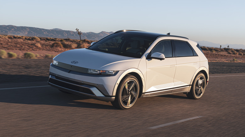 A 2026 Ioniq 5 Limited with retractable door handles drivng down a road