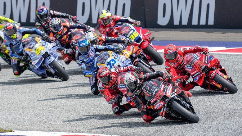 Marco Bezzecchi of Italy and Aprilia Racing leads in the first corner Francesco Bagnaia of Italy and Ducati Lenovo Team, Marc Marquez of Spain and Ducati Lenovo Team, Alex Marquez of Spain and BK8 Gresini Racing MotoGP and Pedro Acosta of Spain and Red Bull KTM Factory Racing during the race of the MotoGP of Austria at the Red Bull Ring on August 17, 2025 in Spielberg, Austria