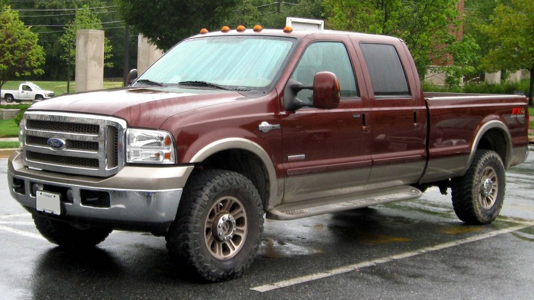 2005-07 Ford F-350 King Ranch crew cab parked on a paved surface with trees in the background