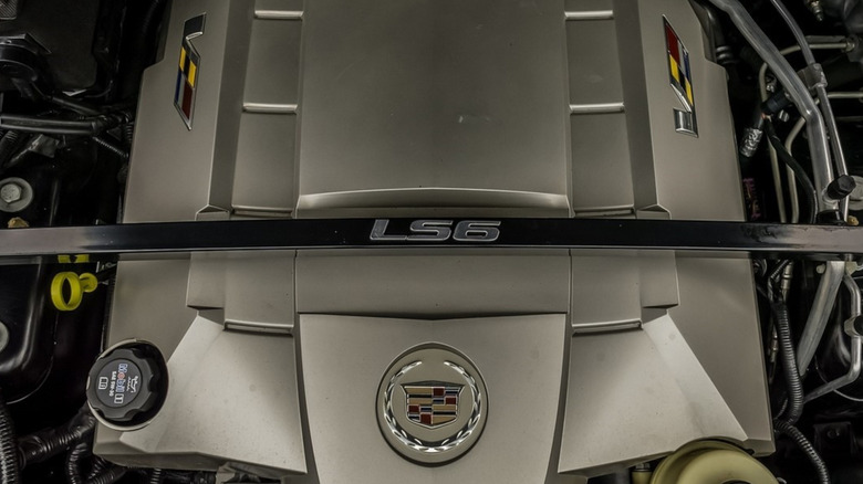 The LS6 badge on a strut brace under the hood of a V1 Cadillac CTS-V