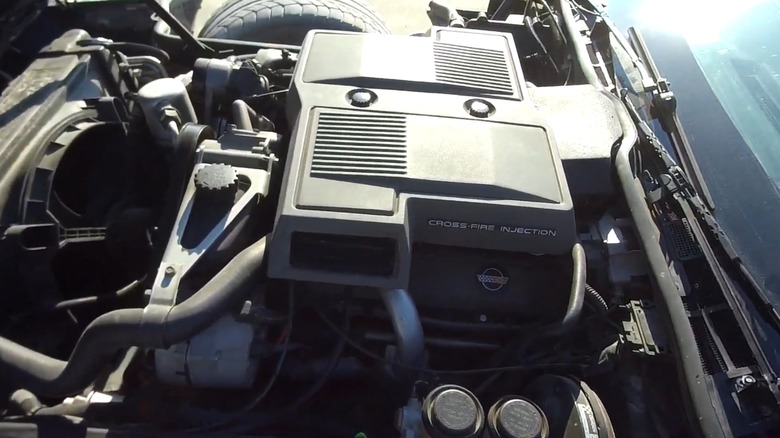 A 1984 Corvette with the hood open showing the Cross-Fire Injection air breather.