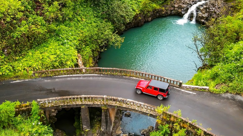 A Jeep driving across a bridge in Hawaii