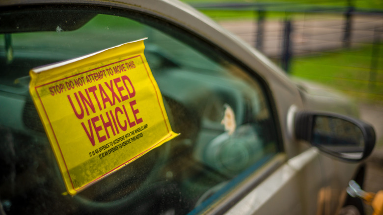 A car with an untaxed sticker on its window