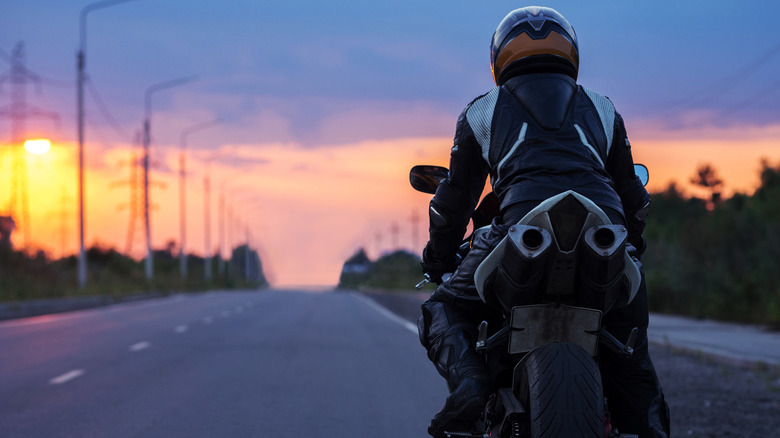 Motorcycle rider on an empty road