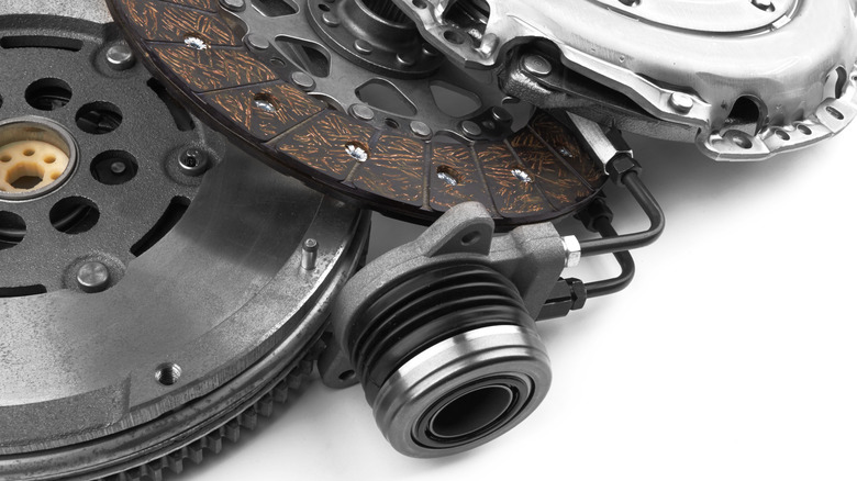 A selection of clutch components, including its hydraulic actuator.