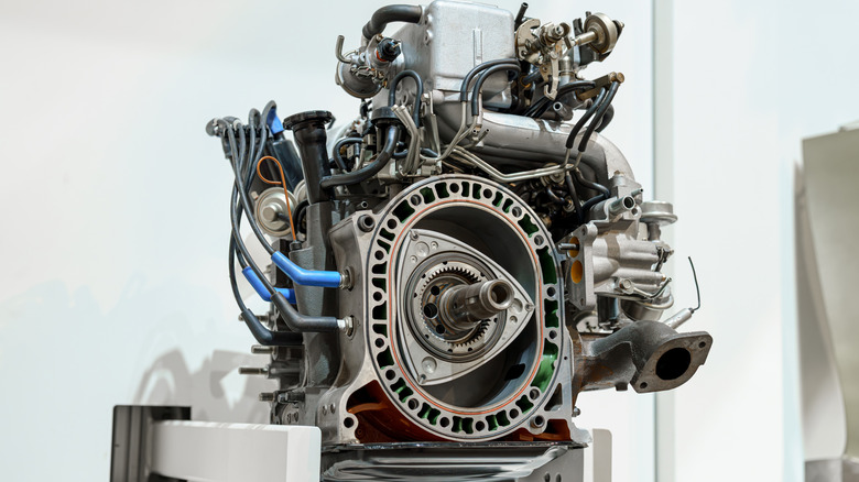 A Wankel rotary engine with the housing removed to show the rotor