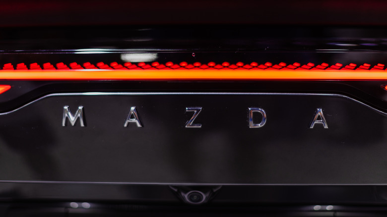 Mazda's script badge on the rear of a car